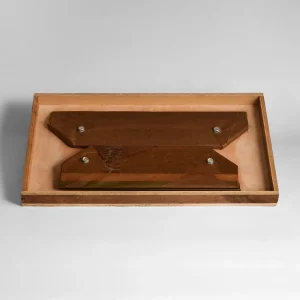 two paper cutter knives fixed on tray of package box